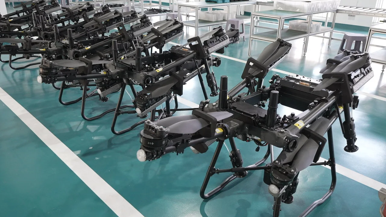 Agricultural drone airframes lined up on the workshop floor at the Jitian Intelligent plant