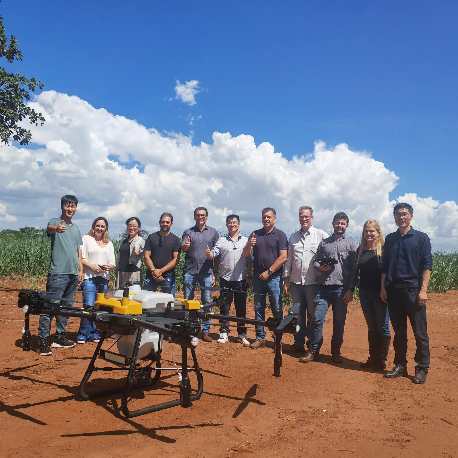 The Jitian Intelligent field team with a spray drone during a field trial