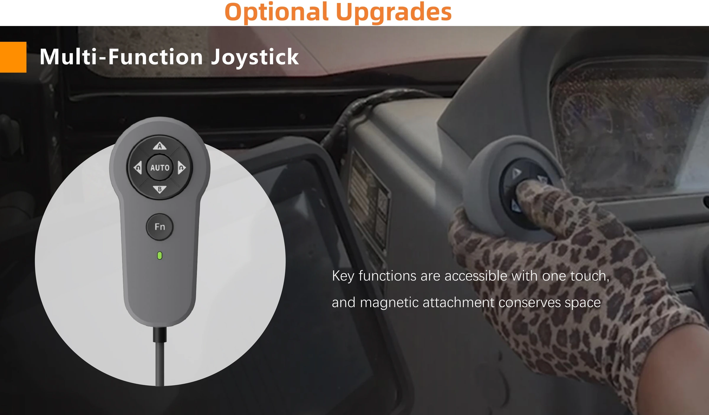 Multi-function joystick with AUTO key and magnetic attachment mounted in a tractor cab