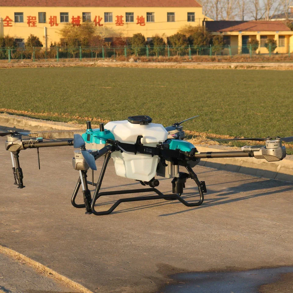 JT-80 on the ground beside a mechanised farming base, showing the tank, nozzle booms and landing gear